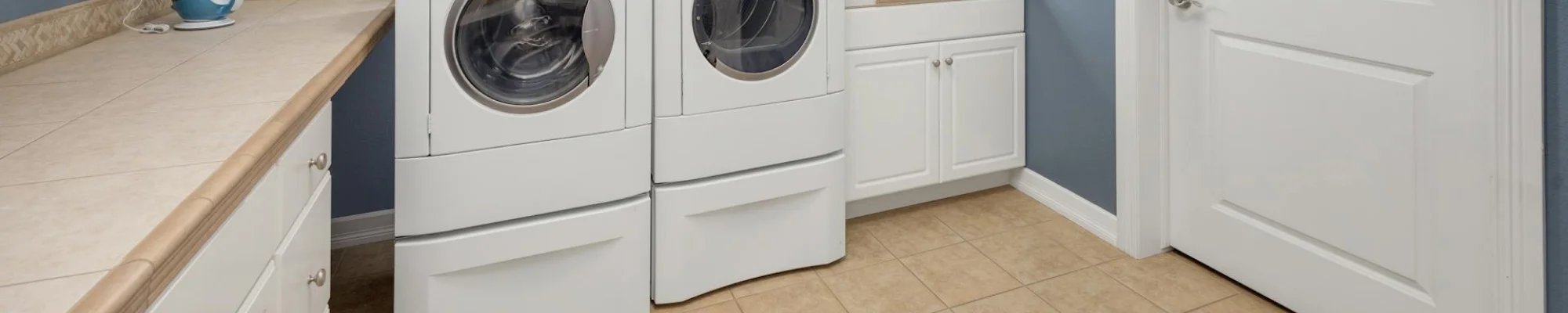 Modern and bright laundry room in Las Vegas NV with waterproof luxury vinyl flooring