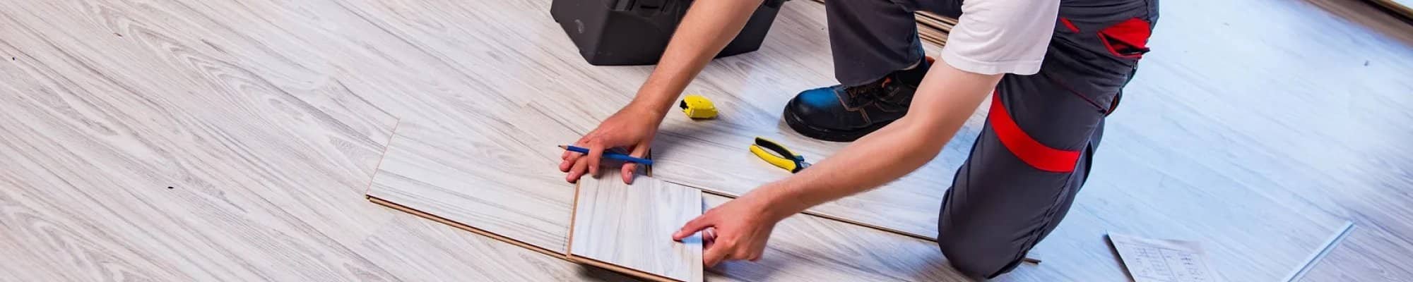 Flooring professional installing flooring planks in Las Vegas, NV