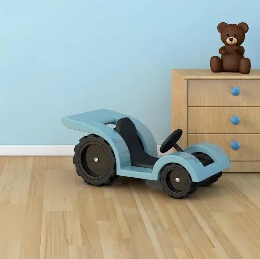 Laminate flooring in a child's room with blue painted walls and a blue toy car